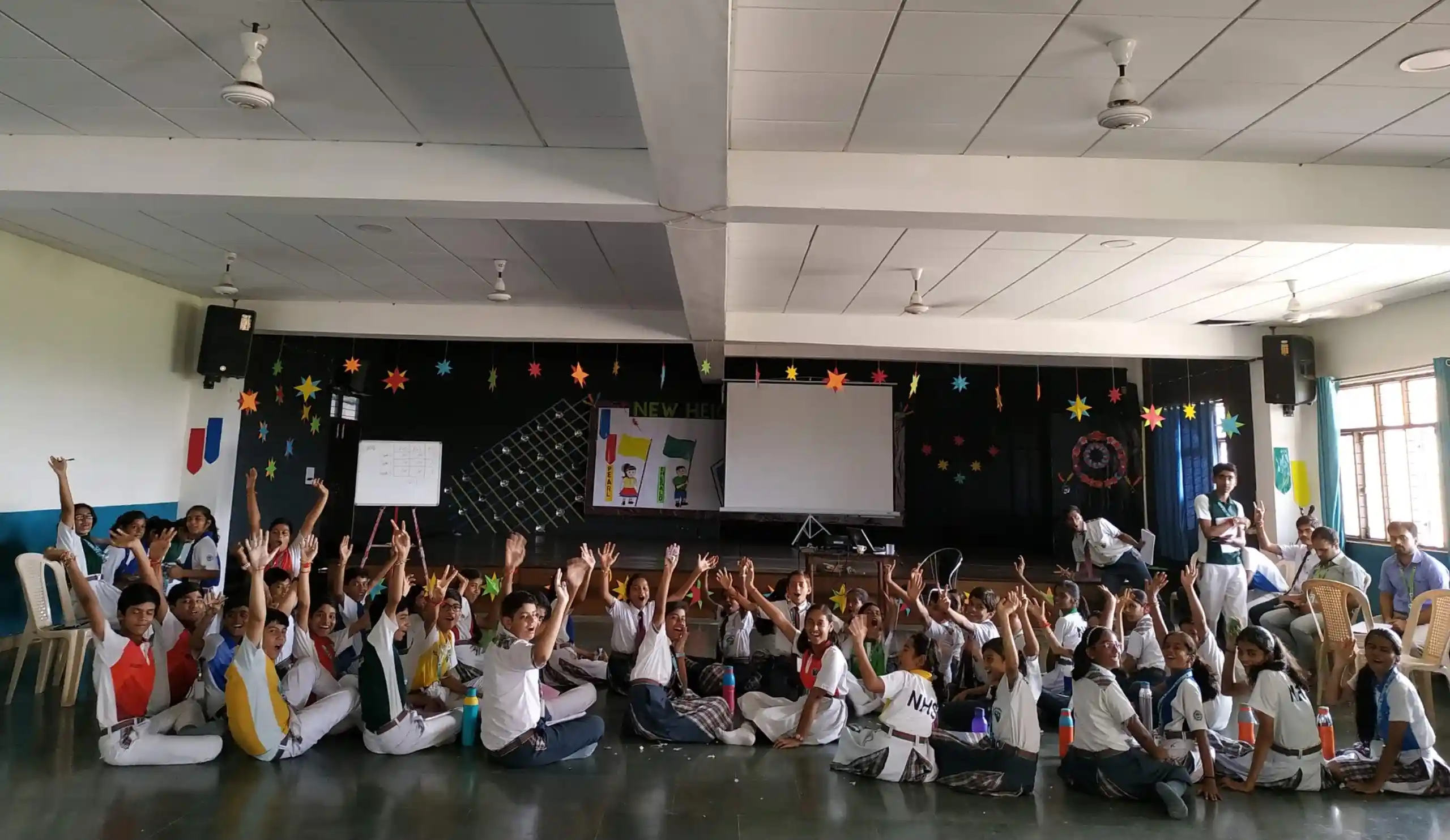 students in excitement sitting together and looking back