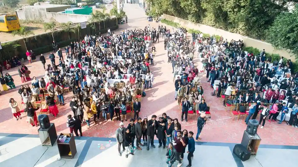 group of people posing for a drone shot